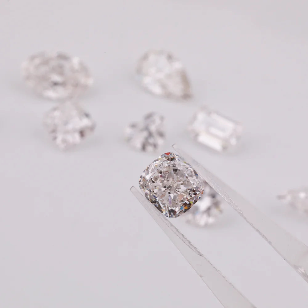 Loose cushion-cut lab diamonds on light background