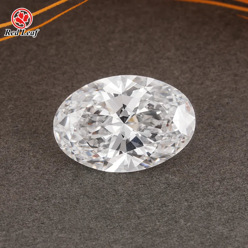 Oval lab-grown diamond, clear faceted loose gem on dark textured surface
