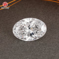 Oval lab-grown diamond, clear faceted loose gem on dark textured surface