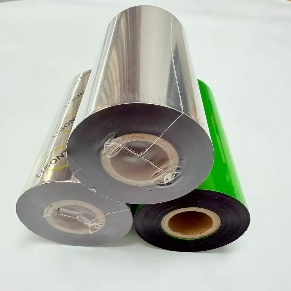Wax thermal transfer ribbon rolls: three spools with silver, green, and black bands