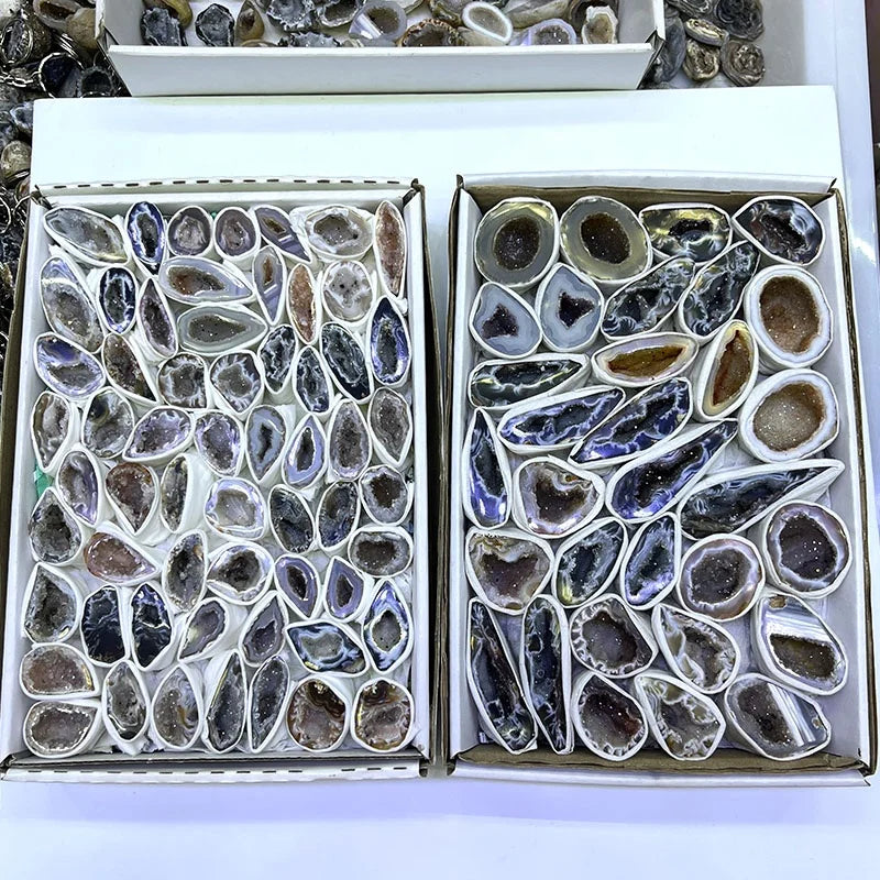 Two agate geode crystal slice gift boxes, assorted dark stones in molded slots