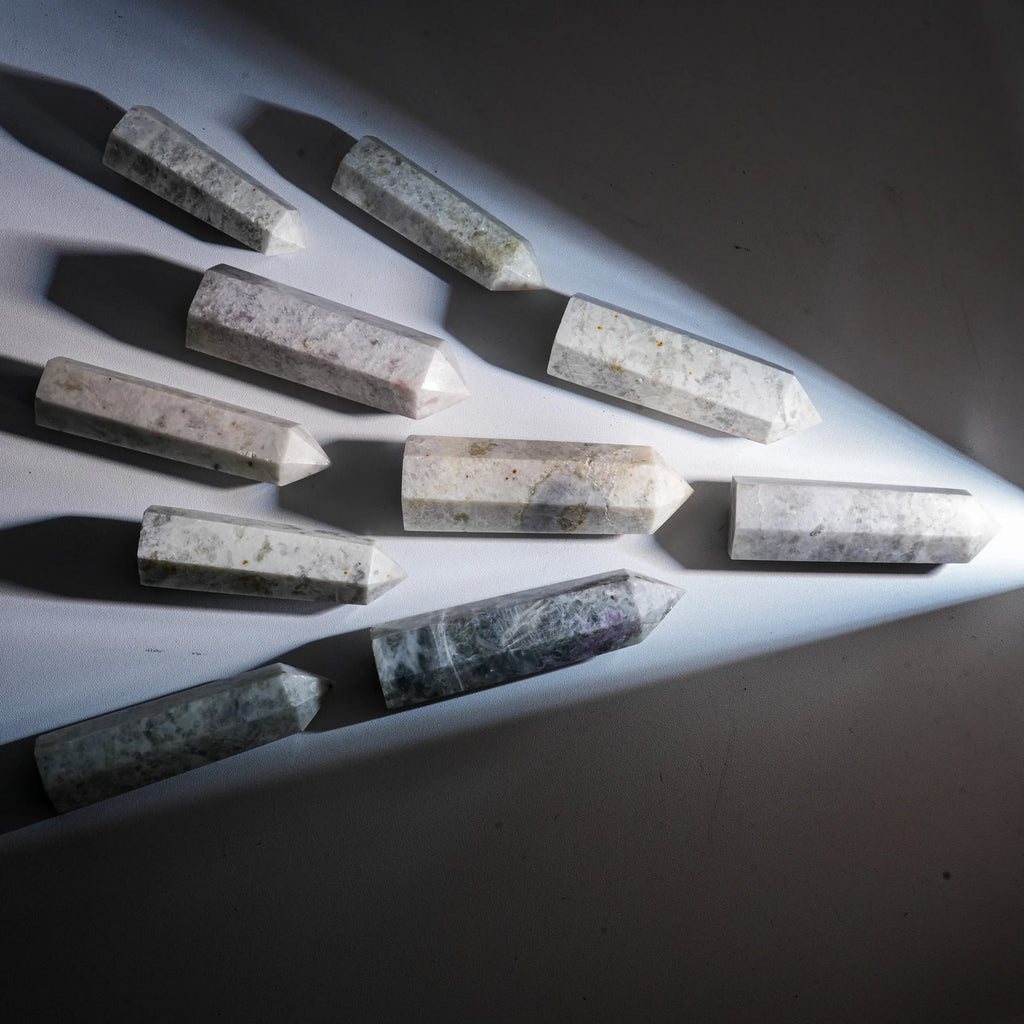 Purple sodalite crystal point towers, rough faceted pointed stones