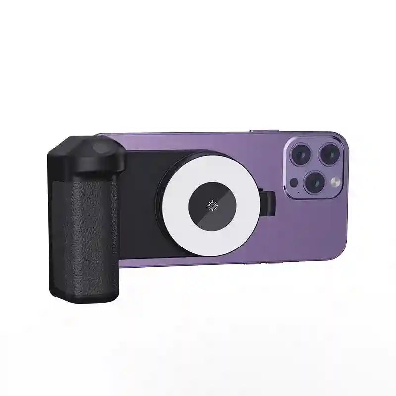Black magnetic smartphone camera grip with integrated circular LED fill light, attached to a purple mobile phone.