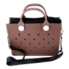 Mauve waterproof EVA trunk tote bag with charm holes, sturdy handles, and a detachable black shoulder strap.
