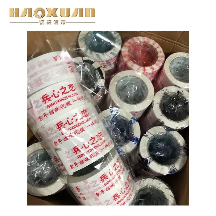 Mixed transparent tape rolls in an assortment of warning prints