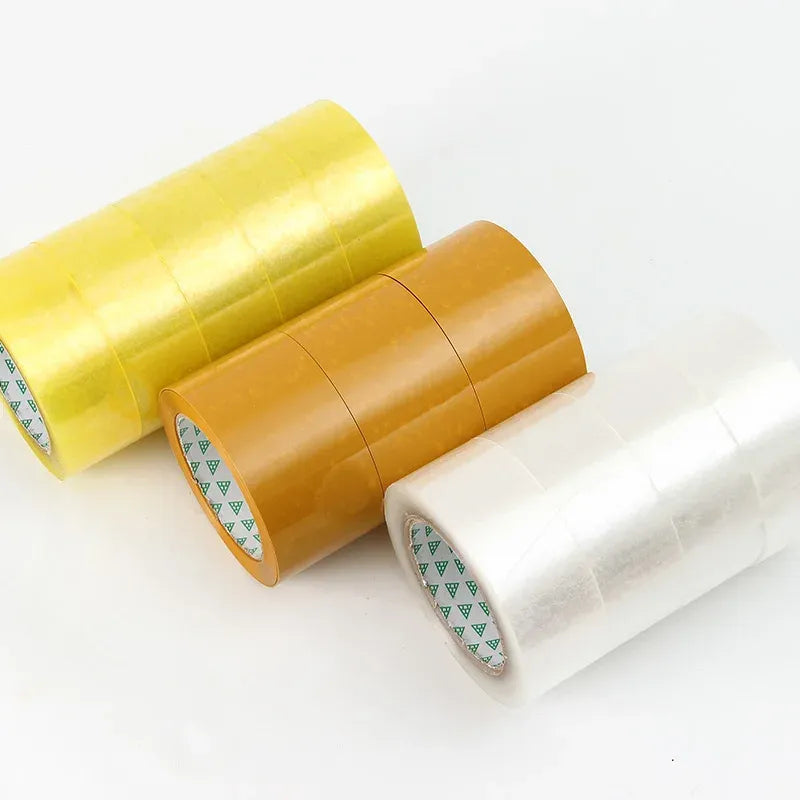 Yellow and amber packing tape rolls lying side by side with printed cores