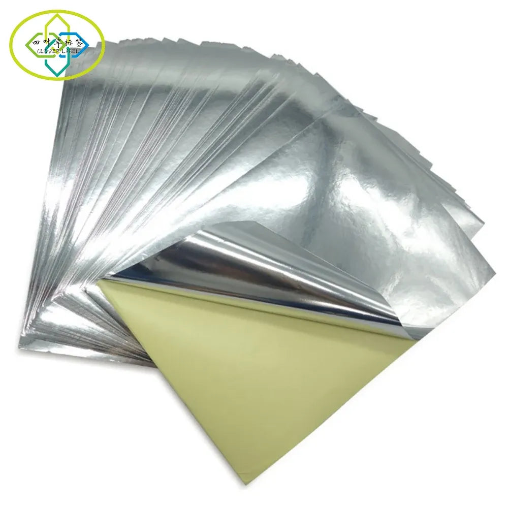 A4 glossy silver vinyl sticker paper sheets, stacked with light backing layers