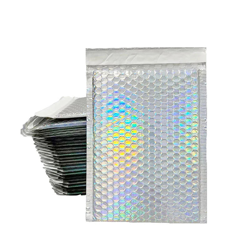 Stack of iridescent bubble mailers with sealed top flap and crinkled edges