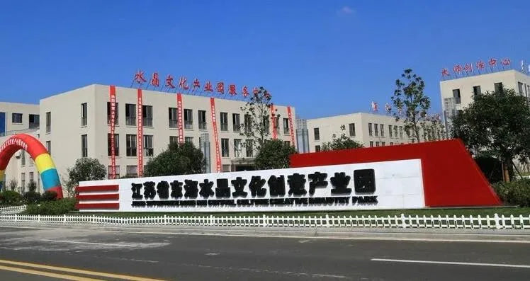 Crystal production facility building exterior with large entrance sign