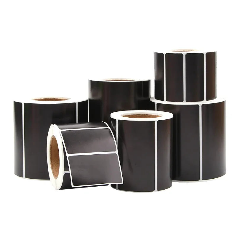 Multiple black thermal label rolls with rectangular label strips and white backing