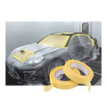 Yellow masking tape and paper used to cover car surfaces for painting