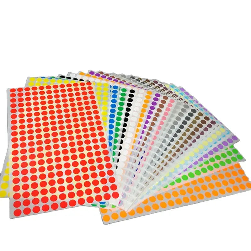 Sheet of multicolor round dot stickers in red, yellow, blue, and purple rows