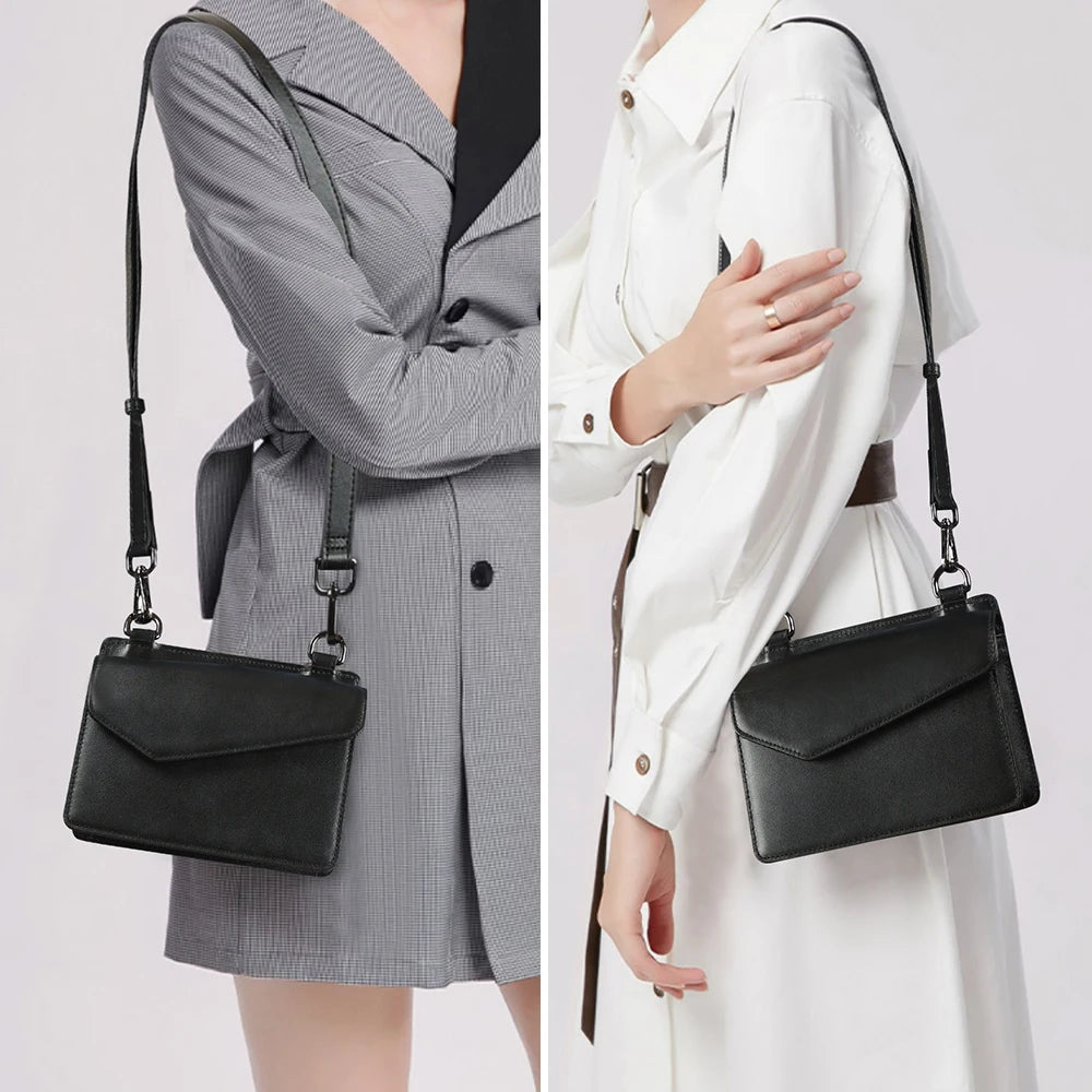 Black genuine cow leather designer crossbody handbag with a sleek envelope flap and adjustable shoulder strap.