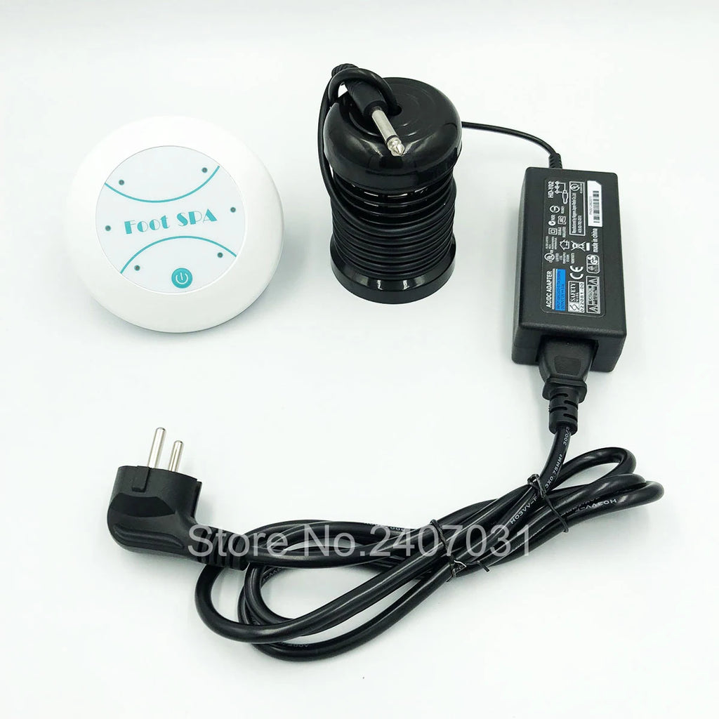 Electric ion detox foot spa machine with white control unit, black round array, power adapter, and wall plug cord.