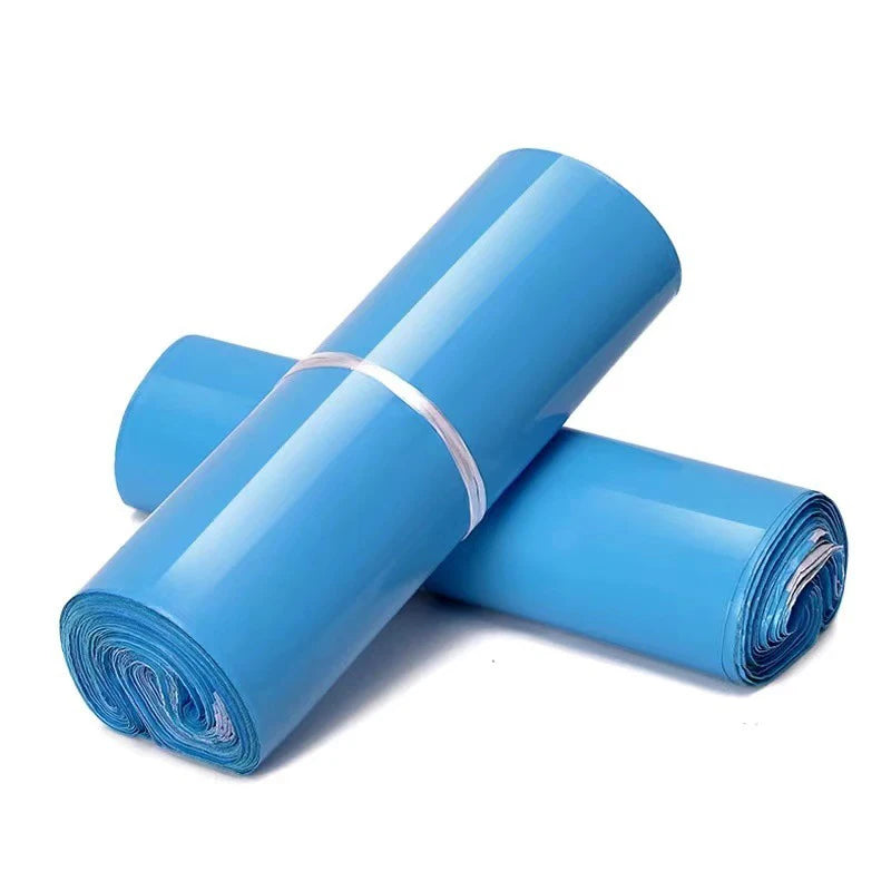 Blue poly mailer rolls stacked and secured with a white band
