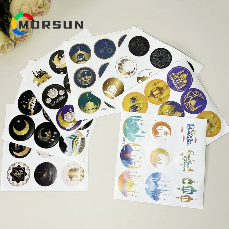 Gold foil circular Ramadan stickers on perforated sheet