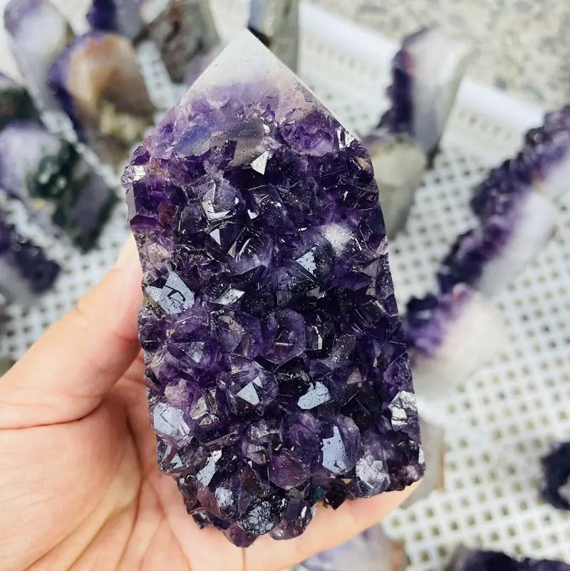 Handheld purple amethyst druzy crystal cluster point