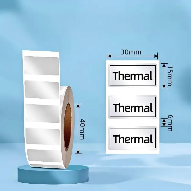 Matte silver thermal label roll with 30x15mm rectangle stickers, tear-resistant backing