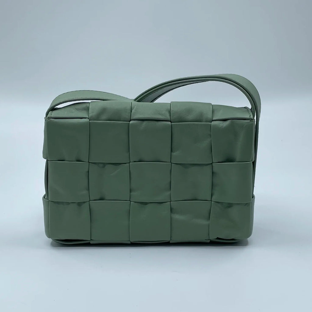 Pre-owned light green leather woven designer shoulder bag with a structured rectangular shape and wide braided detail.