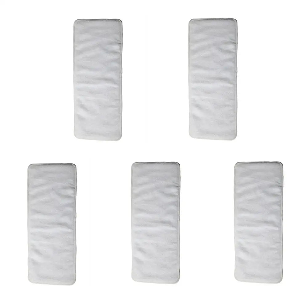 Set of 5 white absorbent cloth diaper inserts for baby care.