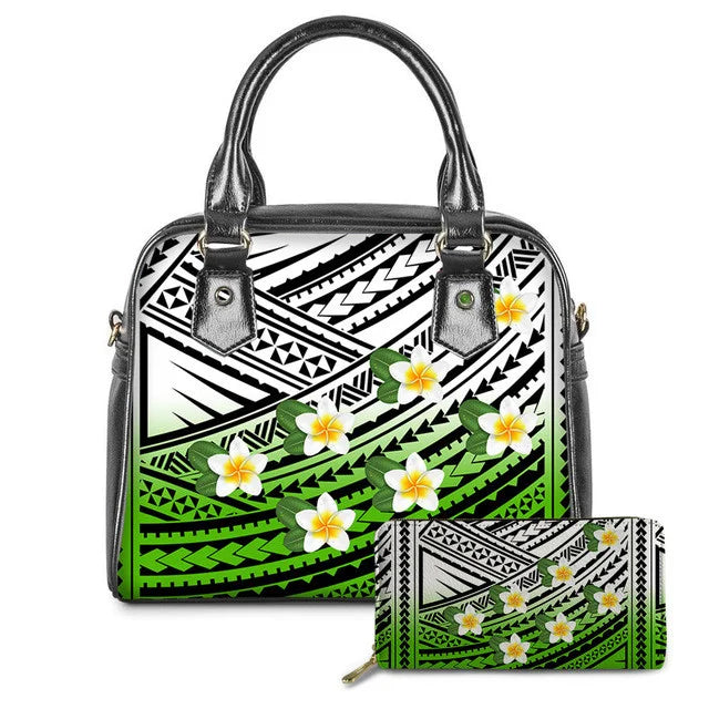 Black and green leather tote bag and wallet set with Polynesian tribal patterns and white plumeria flower prints.