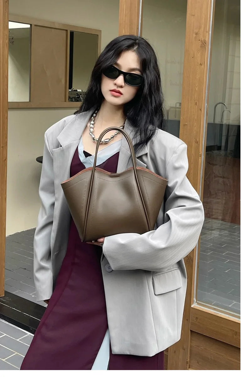 2025 Autumn Winter High-End Niche Genuine Leather Wing Bag Large Capacity Commuter Shoulder Promotional Drawstring Sportpacks