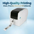 White direct thermal barcode printer with printed QR label and wristband strap