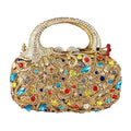 Gold peacock-shaped evening clutch with colorful sparkling rhinestones, crystal embellishments, and top handle design.