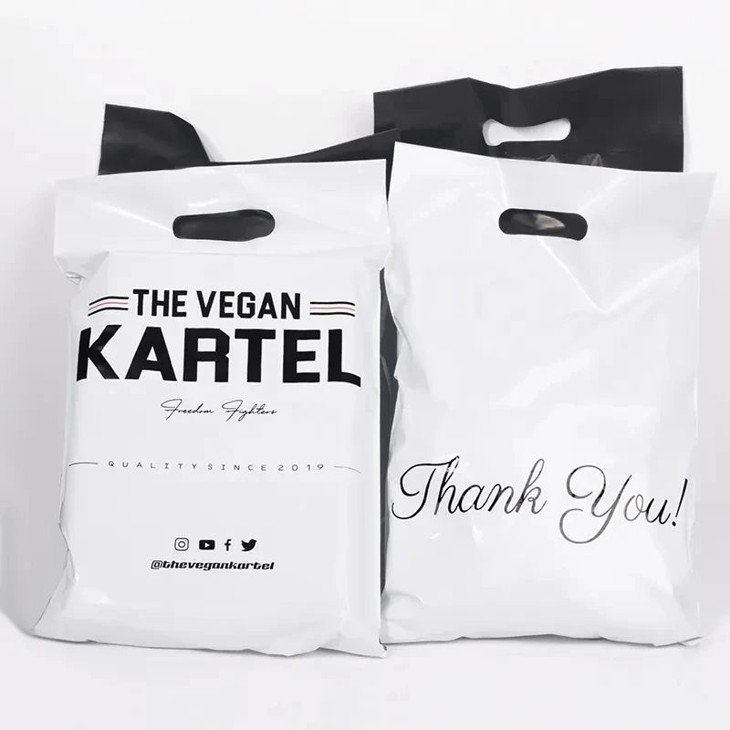 White plastic poly mailer bags with "THE VEGAN KARTEL" logo and "Thank You!" text