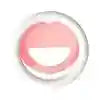 Round pink silicone facial cleansing pad with textured bristles for exfoliating and washing the face.