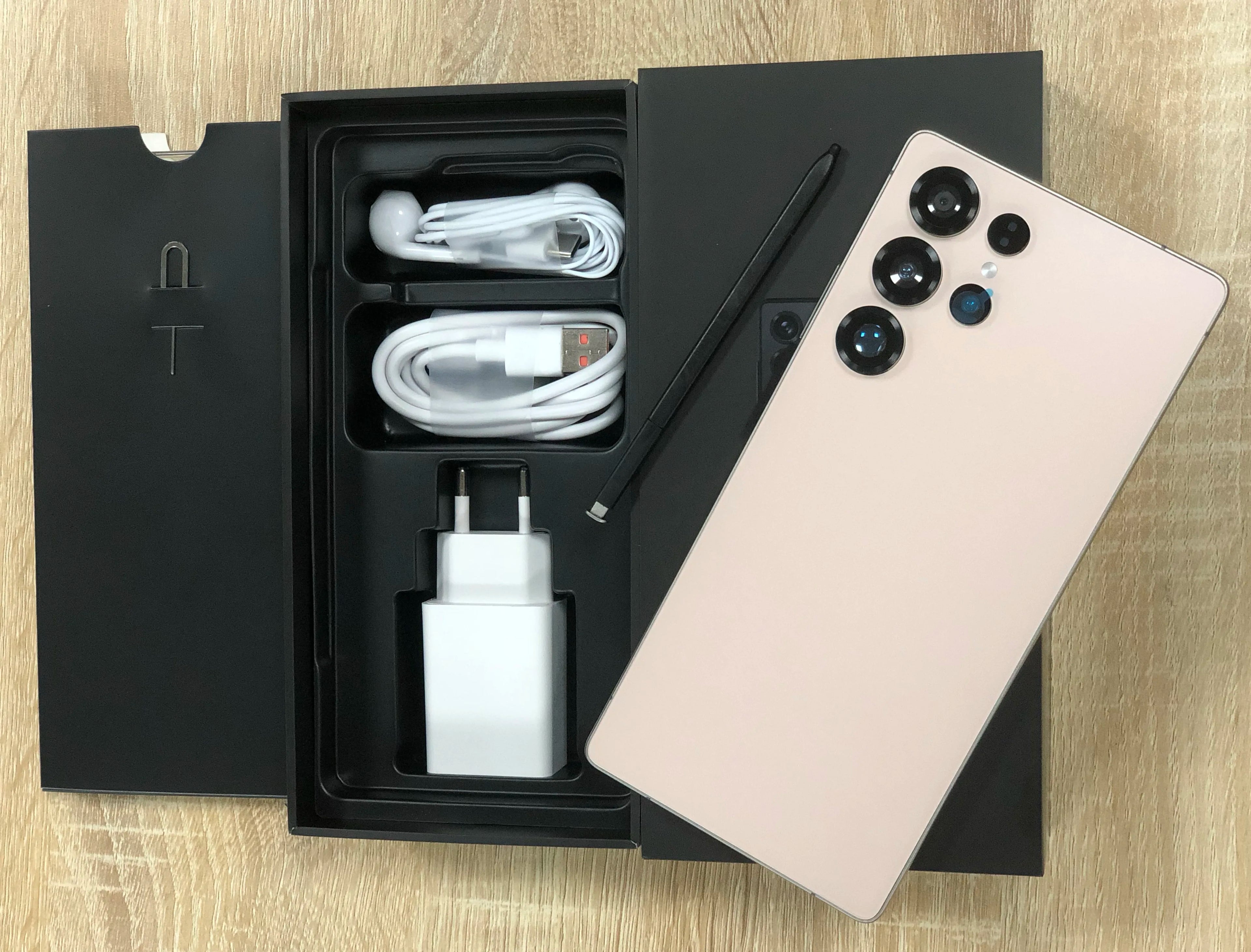 7.3-inch Android smartphone unboxed with charging cable and charger plus rear phone