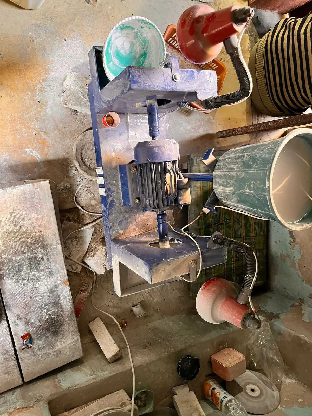 Gem polishing machine in a jewelry workshop with tools and parts
