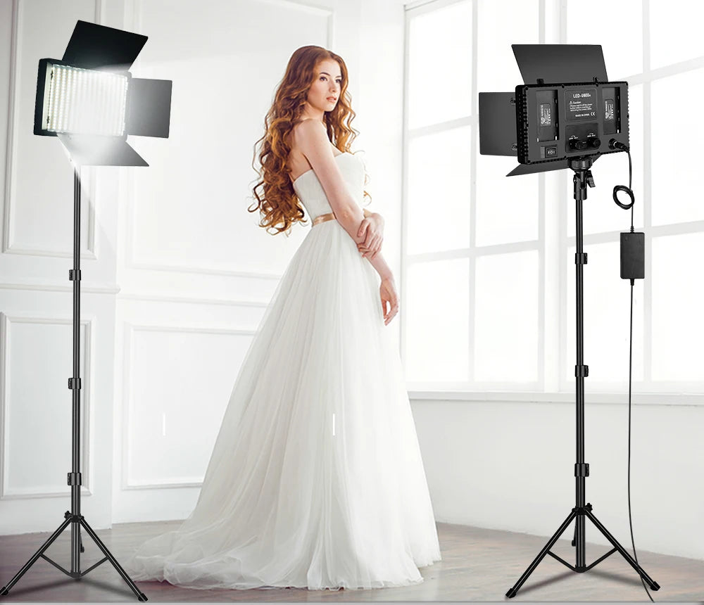 LED panel studio light kit with adjustable tripod stands and barn doors for professional photography and video lighting.
