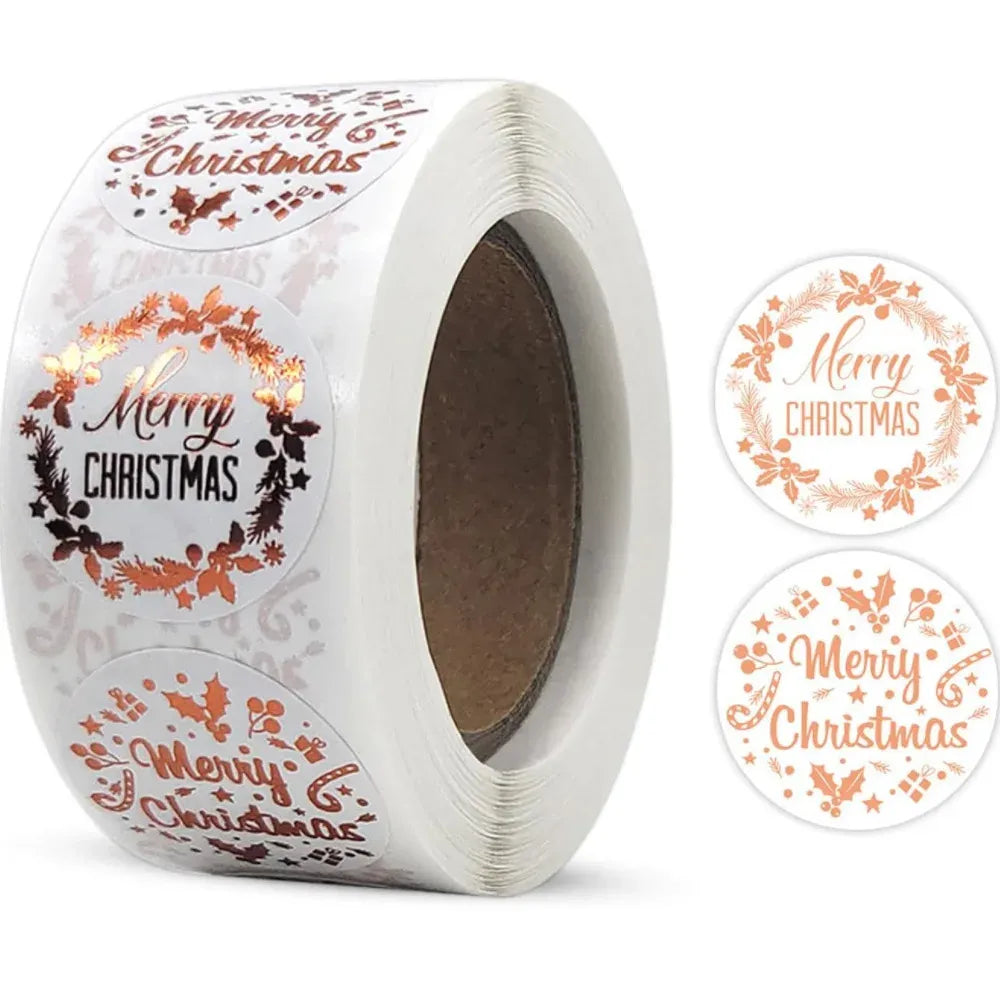 Close-up roll of round Merry Christmas stickers with wreath designs in gold and orange