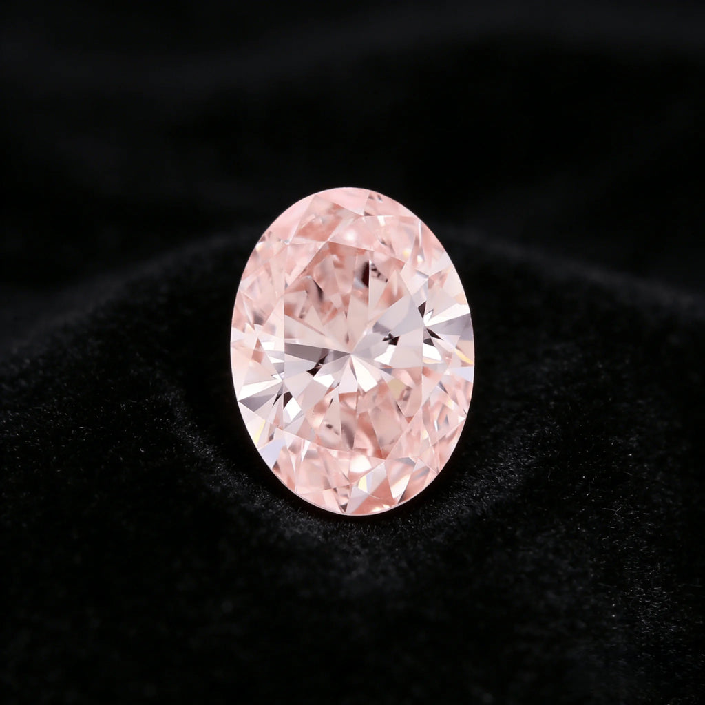 Oval fancy pink lab-grown diamond face-up with prominent sparkle and facets