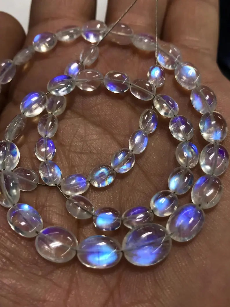 Rainbow moonstone blue fire oval briolette beads strung in a bracelet
