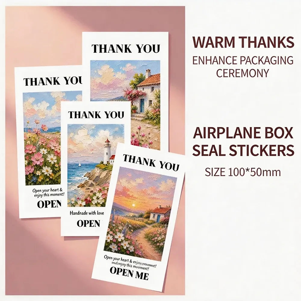 Airplane box seal stickers with "THANK YOU" and "OPEN ME" landscape artwork