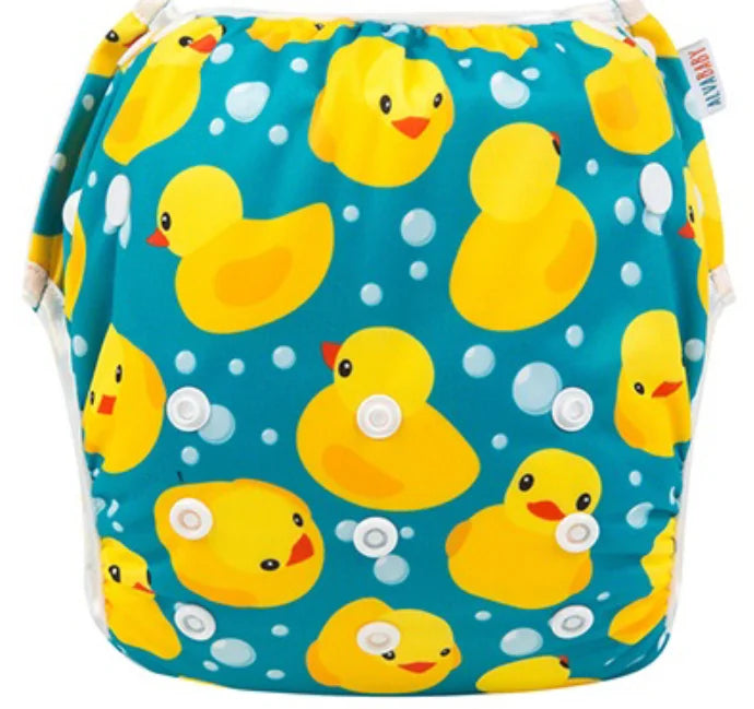 Alvababy reusable cloth diaper with yellow rubber duck print on teal blue background.