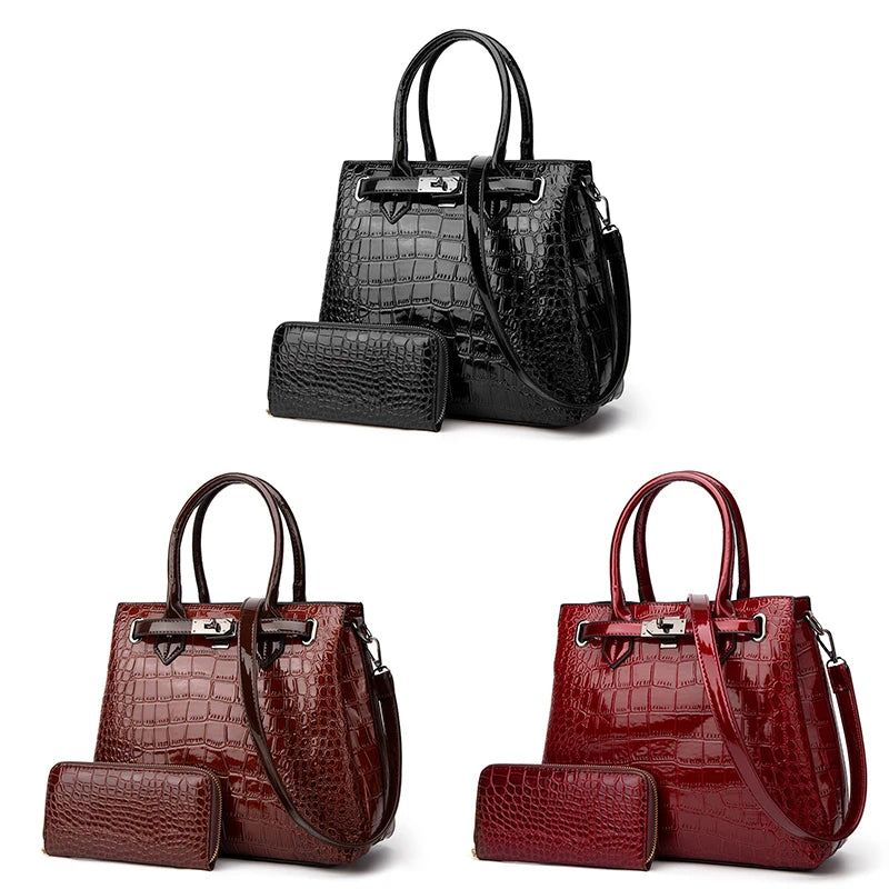 Black, brown, and red crocodile-pattern leather handbag and wallet sets with top handles and shoulder straps.