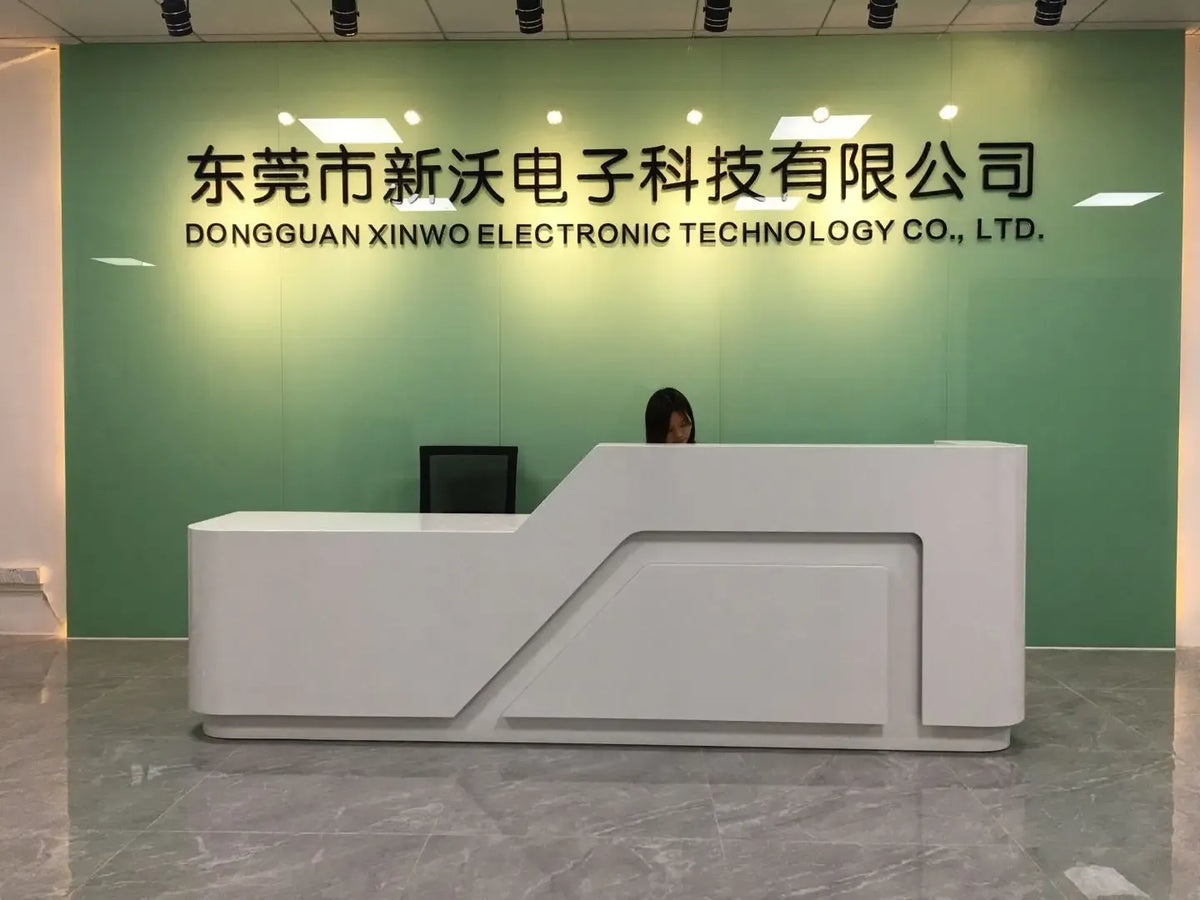 Office reception area with modern desk and wall signage in the room