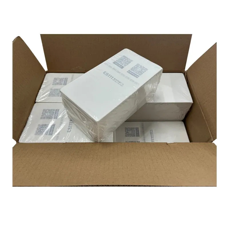 Thermal label paper bundles in open cardboard box for shipping