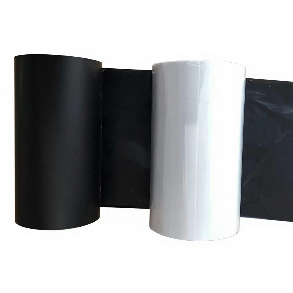 Black thermal transfer wax resin ribbon rolls on cores, glossy black outer wrap