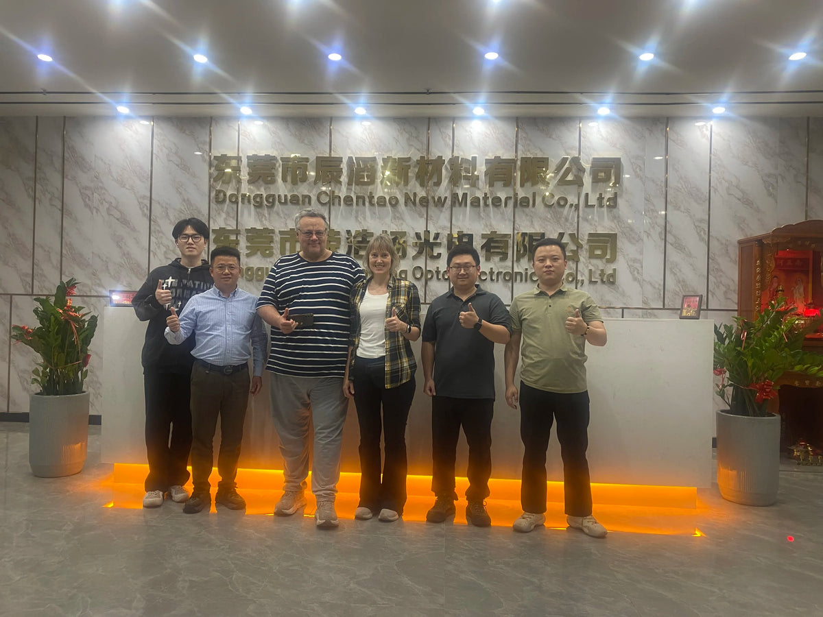 Group of people standing indoors; no tape product visible