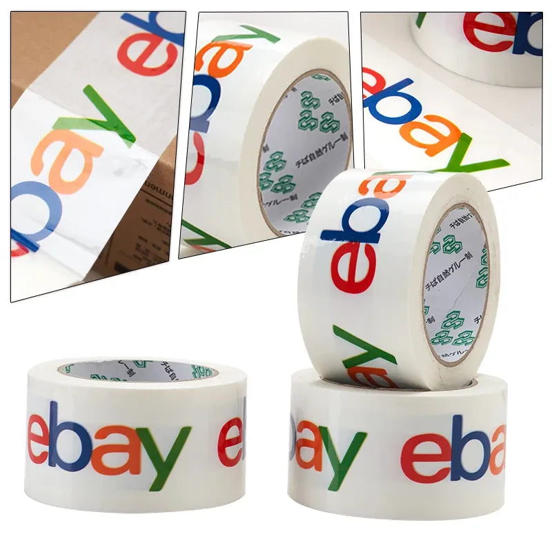 Multiple white packing tape rolls with colorful eBay logo print on tape strips