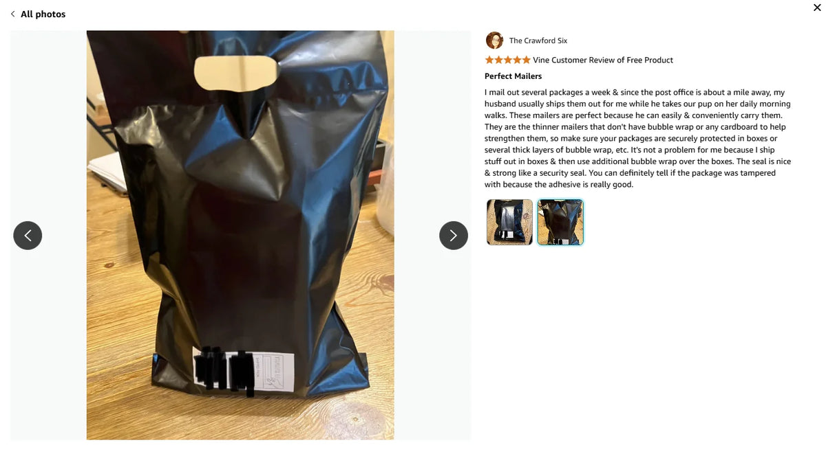Black poly mailer bag with shipping label, shown opened on a countertop