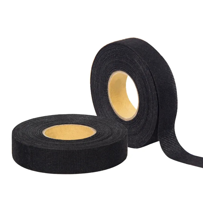 Black cloth tape roll with exposed inner adhesive layer for wire harness wrapping
