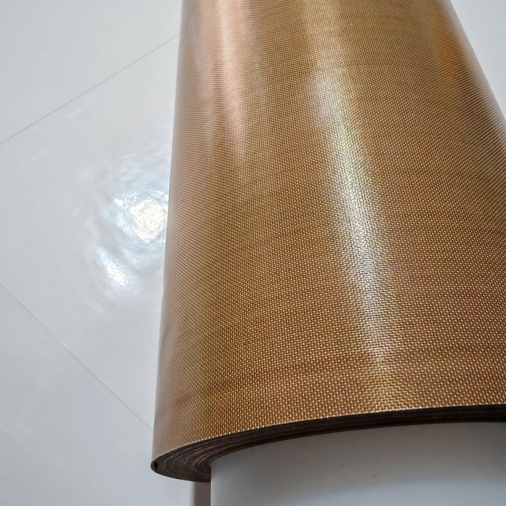 Close-up of brown PTFE tape roll surface with fine woven texture
