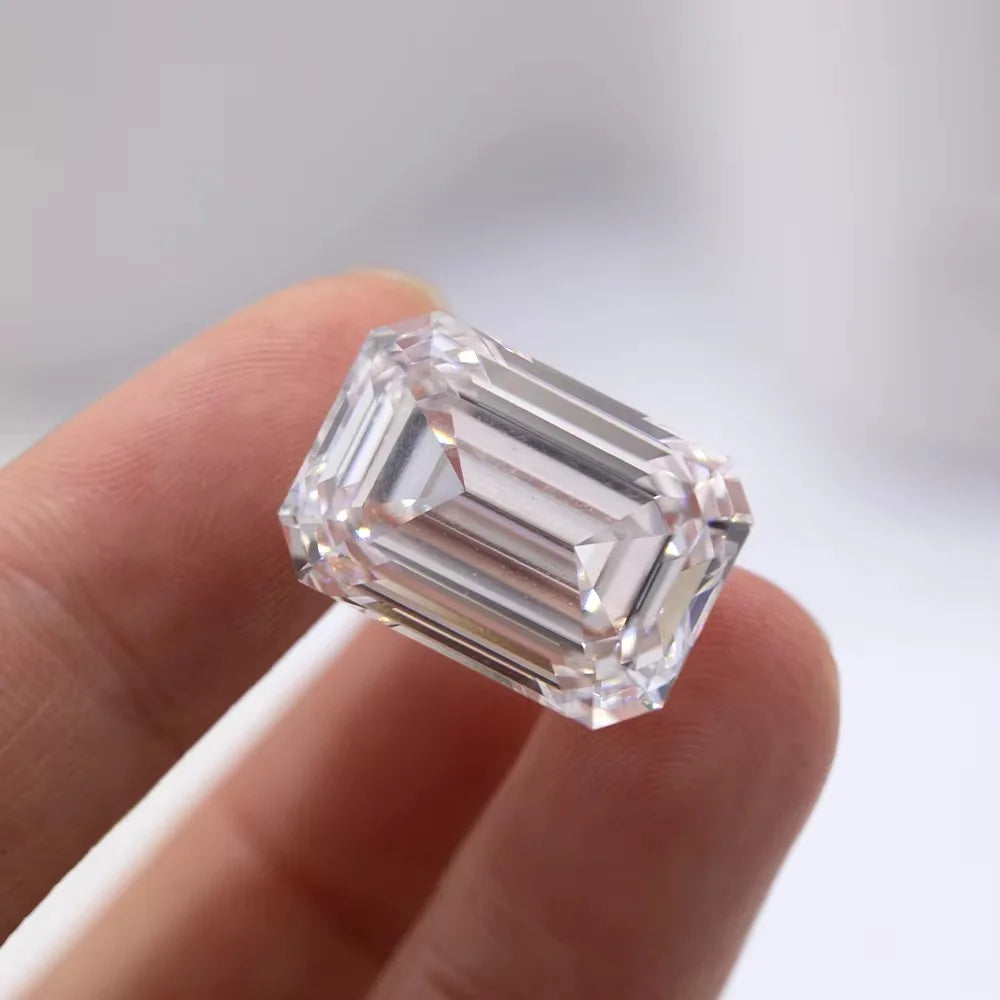 Emerald-cut lab-grown diamond, clear D color, faceted sparkle, loose stone close-up.