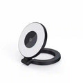 Black and white circular LED ring light with a folding stand for tabletop lighting.
