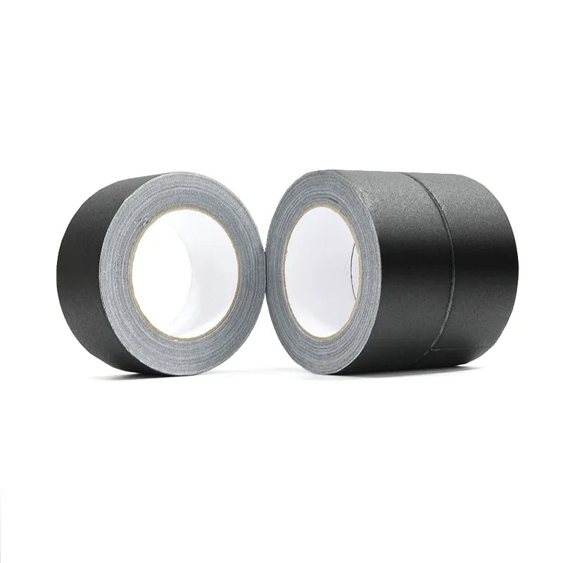 Two rolls of black matte gaffer tape with gray inner core and matte surface